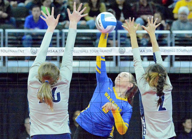 Castlewood's Mackenzie Everson (center) smacks the ball against Burke's Paige Bull (26) and Johanna Vaughn during their first-round Class B match in the state high school volleyball tournament on Thursday, Nov. 17, 2022 in the Denny Sanford PREMIER Center.