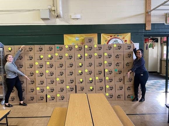 Evergreen School provides food for families. Pictured are Evergreen social workers, Lauren A. Rodriguez and Roxanna Valentin.