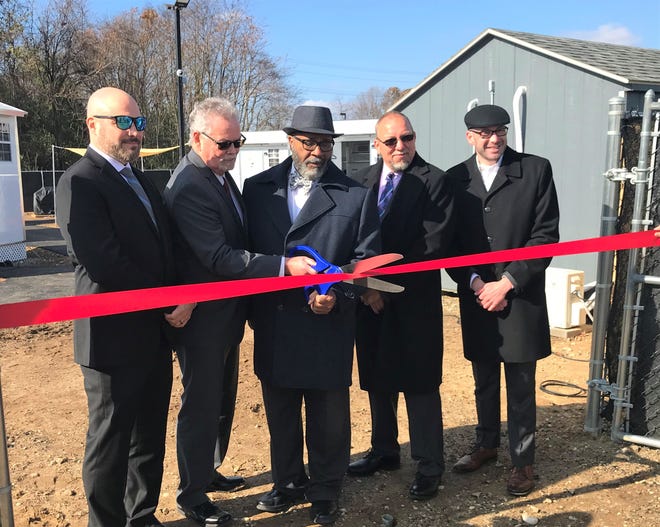 Village of Hope is not yet occupied, but Thursday was the opening day of the pilot community "tiny house" intended for newly released prisoners.  L-R: Paul Tuggins, Chief Operating Officer, The Kintock Group;  Kevin McHugh, Executive Director, Reentry Coalition of New Jersey;  Bridgeton Mayor Albert Kelly;  state Sen. Edward Darr, R-3;  and Rev. Robin Weinstein, Bethany Grace Community Church.  Six manufactured homes are located at 5 West Industrial Boulevard in Bridgeton.  Photo/November.  17, 2022
