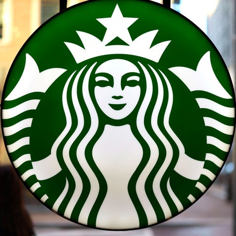 FILE - The Starbucks logo is displayed in the wind