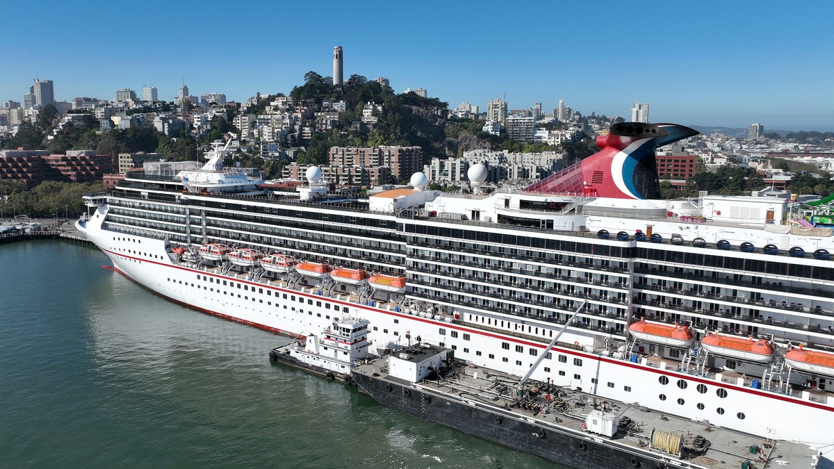In an aerial view, the Carnival Miracle cruise ship operated by Carnival Cruise Lines sits docked at Pier 27 on September 30, 2022 in San Francisco, California.