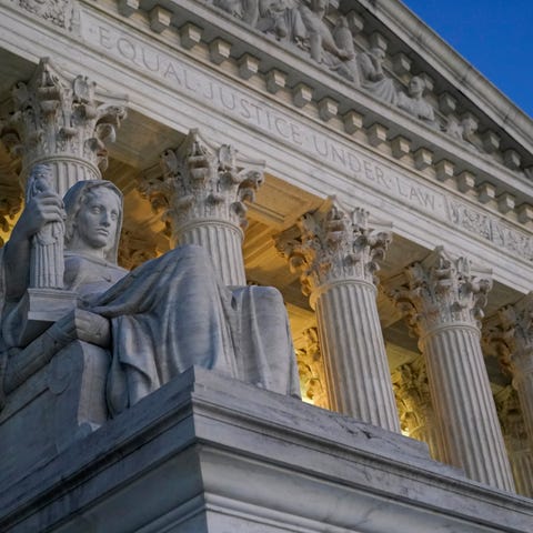 Light illuminates part of the Supreme Court buildi