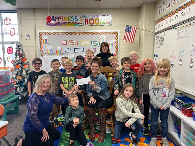 Lawrence County Community Foundation board member Jo Ann Ash presents a grant to Allison Brown. Judy Quyle, CFP administrative assistant is in the back. Mrs. Brown’s students are also pictured.