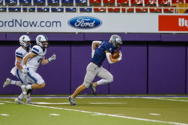 Xavier wide receiver Aidan McDermott (1) runs towards the end zone during the Class 4A Playoff Championships on Thursday, November 17, 2022 at the UNI Dome in Cedar Falls. The Saints are up 17-14 to the Titans at halftime.