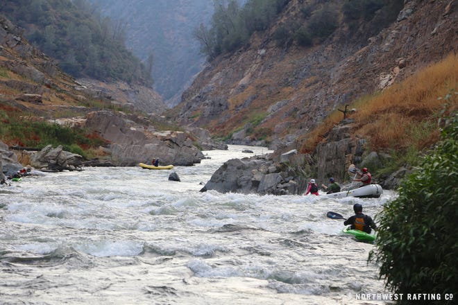 Rafters navigate their way down a section of the Stanislaus River that is normally impounded by New Melones Lake (Dam). The California drought in 2014 allowed people to kayak this famous section of river.