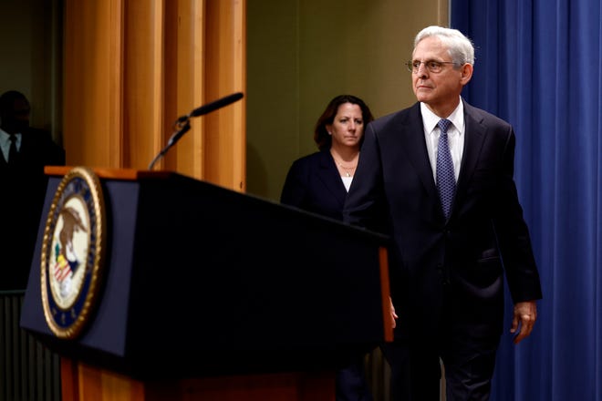 Attorney General Merrick Garland and Deputy Attorney General Lisa O. Monaco arrive to deliver remarks at the U.S. Justice Department.