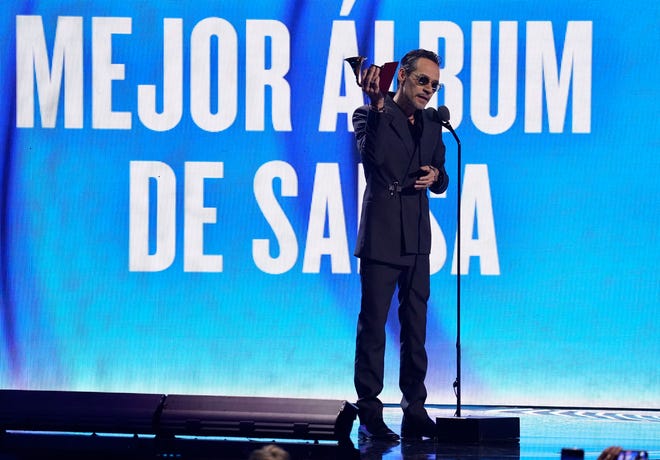 Marc Anthony accepts the award for best salsa album for "Pa'lla Voy."