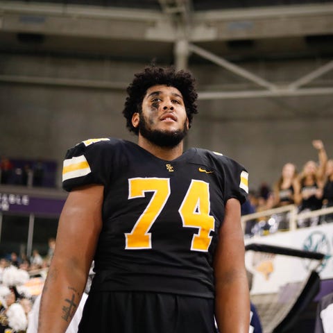 Southeast Polk lineman Kadyn Proctor (74) takes in