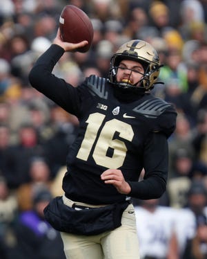 Purdue Boilermakers quarterback Aidan O'Connell (16) throws a pass to Purdue Boilermakers wide receiver Charlie Jones (15) for a touchdown during the NCAA football game against the Northwestern Wildcats, Saturday, Nov. 19, 2022, at Ross-Ade Stadium in West Lafayette, Ind. 