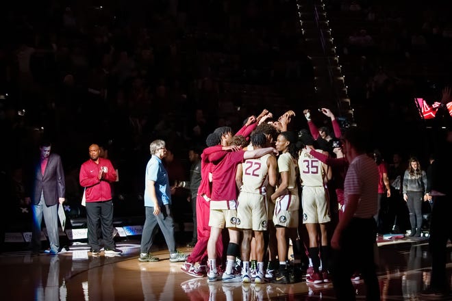 Florida State men's basketball players huddle up ahead of Friday's game against rival Florida.