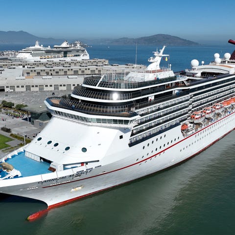 The Carnival Miracle cruise ship sits docked at Pi