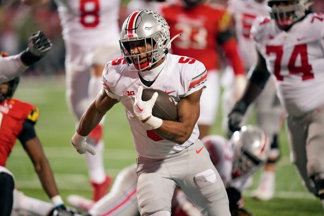 Nov 19, 2022; College Park, MD, USA; Ohio State Buckeyes running back Dallan Hayden (5) scores a rushing against Maryland Terrapins in the fourth quarter in their Big Ten game at SECU Stadium. 