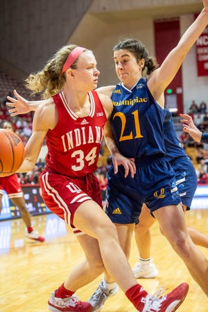 Indiana's Grace Berger (34) passes around Quinnipiac's Jackie Grisdale (21) during the Indiana versus Quinnipiac women's basketball game at Simon Skjodt Assembly Hall on Sunday, Nov. 20, 2022.