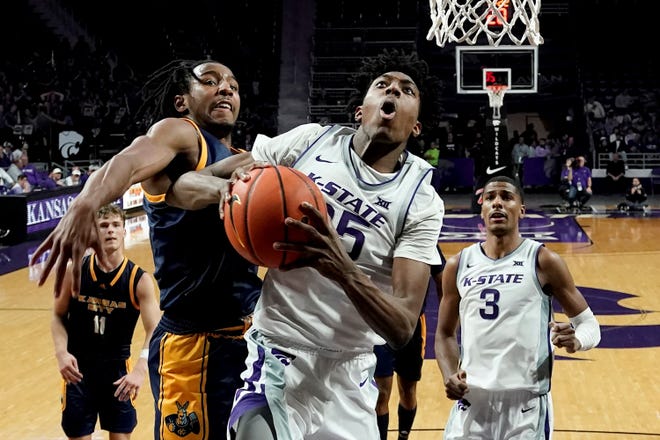 Kansas State forward Nae'Qwan Tomlin (35) puts up a shot under pressure from Kansas City's Shemarri Allen (5) during Thursday's game at Bramlage Coliseum. K-State faces Rhode Island at 6:30 p.m. Monday in the first round of the Cayman Islands Classic.