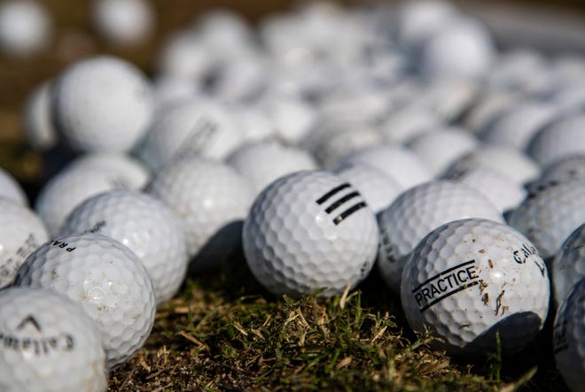 Golf balls are seen set out for use on the driving range at The Lights at Indio in Indio, Calif., Saturday, Nov. 19, 2022. 