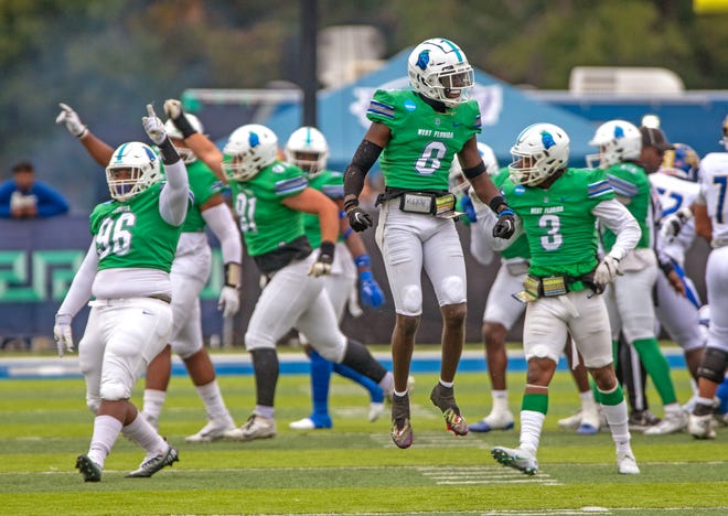 West Florida' players celebrate after stopping Limestone on a fourth down during first round of the 2022 NCAA Division II Football Championship against the Limestone Saints at Pen Air Field Saturday, November 19, 2022.. West Florida went on to beat Limestone 45-19.