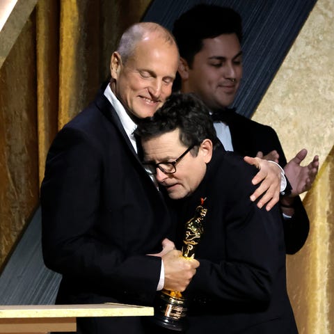 (L-R) Woody Harrelson congratulates Michael J. Fox