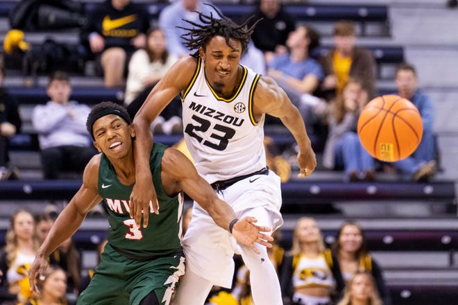 Mississippi Valley State's Kadar Waller, left, battles Missouri's Aidan Shaw, right, for the ball during the second half of an NCAA college basketball game Sunday, Nov. 20, 2022, in Columbia, Mo.