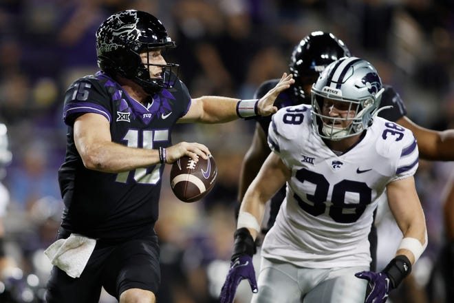 Kansas State defensive end Brendan Mott chases TCU quarterback Max Duggan during an Oct. 22 game in Forth Worth, Texas. Mott was named Big 12 defensive player of the week Monday for his performance Saturday against West Virginia.