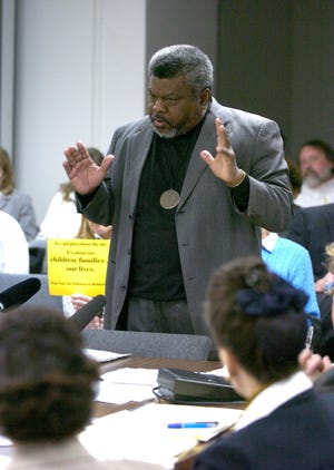-
-Text: Photo by David Harpe, SPECIAL TO THE COURIER-JOURNAL March 17th, 2004 The Reverend Louis Coleman of the Justice Resource Center speaks before the Air Pollution Control Board.