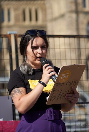 Lindsey Bacigal who is a part of the environmental justice movement speaks at a climate march in 2019