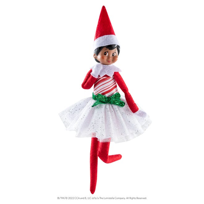 A Scout Elf in a candy cane dress.