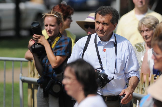 Pete Souza, Official White House Photographer for both Barack Obama and Ronald Reagan, photographs Obama in Sandusky, Ohio as photojournalist and former student Angela Wilhelm, left, follows his lead on the campaign trail in 2012.