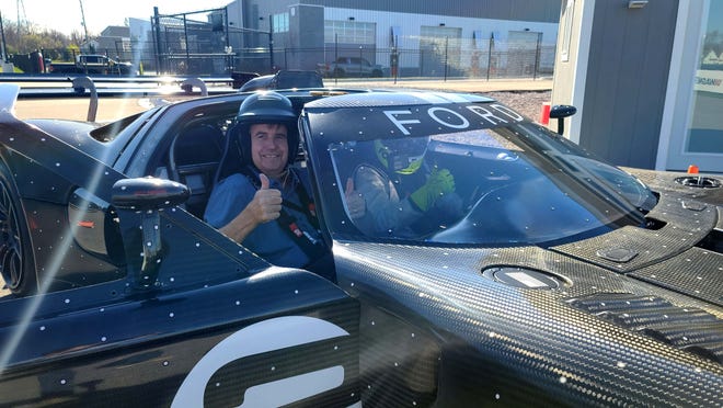 Buckled up. Detroit News auto critic Henry Payne rides shotgun with GT1 CEO Fred Calero at M1 Concourse.