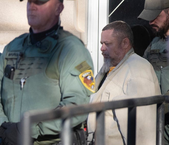 Officers transport murder suspect Richard Allen during a hearing regarding sealed documents, Tuesday, Nov. 22, 2022, at Carroll County Courthouse in Delphi, Ind. 