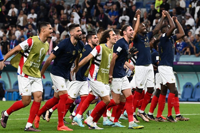 France players celebrate with supporters after they won the Qatar 2022 World Cup Group D football match over Australia at the Al-Janoub Stadium in Al-Wakrah, south of Doha on November 22, 2022. (Photo by Chandan KHANNA / AFP) (Photo by CHANDAN KHANNA/AFP via Getty Images) ORIG FILE ID: AFP_32QX8L6.jpg
