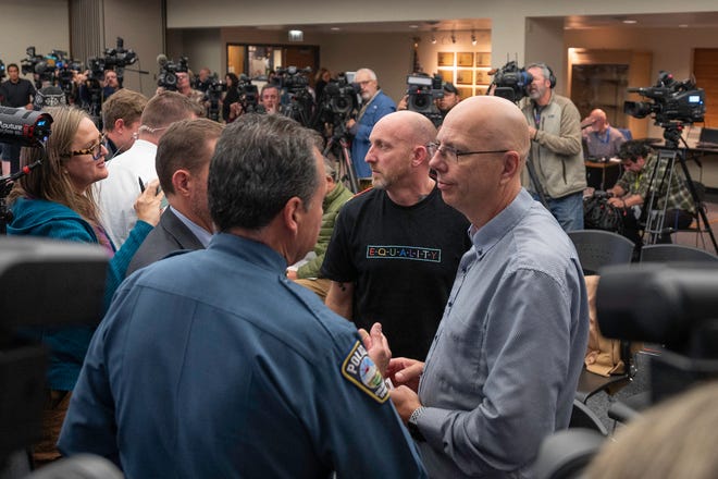 Club Q owners Matthew Haynes, right, and Nick Grjeka, center right, speak with Colorado Springs Police Chief Adrian Vasquez after a press conference on the shooting on Monday, Nov. 21, 2022, in Colorado Springs, Colorado.