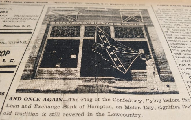 A Hampton County Guardian newspaper clipping from the early 1950s shows a Confederate flag flying in front of the Hampton Loan and Exchange Bank. When a similar photo was widely published in his Associated Press, Hampton banker RO Borden received emails from across the country that were both laudatory and condemning.