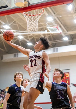 Edgewood's Mialin White (22) scores during the Bloomington South versus Edgewood boys basketball gamet at Edgewood High School on Tuesday, Nov. 22, 2022.