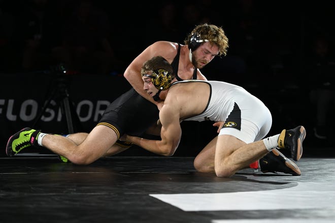 Iowa's Jacob Warner (left) wrestled Missouri's Rocky Elam in the 2022 NWCA All-Star Classic Tuesday at the FloSports Event Center in Austin, Texas.  Elam scored three takedowns and beat Warner 8-6 in a sudden win.