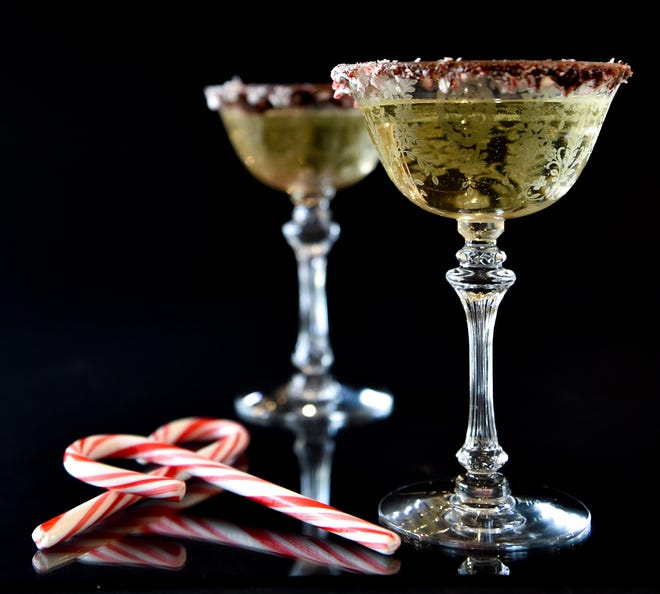 The 'Peppermint Bark Spritz' is a sweet and unique take on the holidays; don't forget to rim the glass with melted chocoate and crushed candy canes.