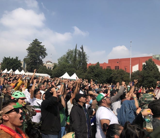 Mexico national team fans react to a big play for their side at the FIFA Fan Festival in Mexico City, where thousands attended a World Cup watch party on Nov.  22.