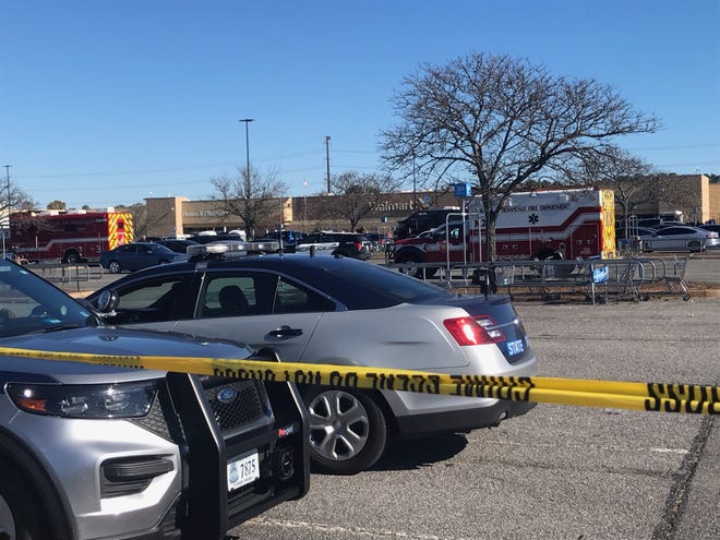 First responder vehicles outside a Walmart that was the site of a mass shooting in Chesapeake, Va.