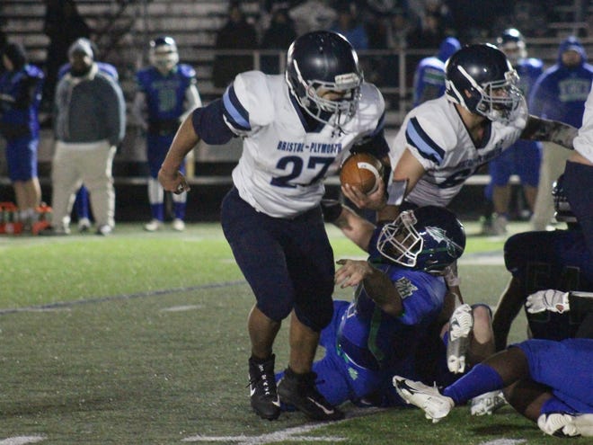 Bristol-Plymouth running back Jose Ruiz carries the ball during the annual Thanksgiving game against Blue Hills.