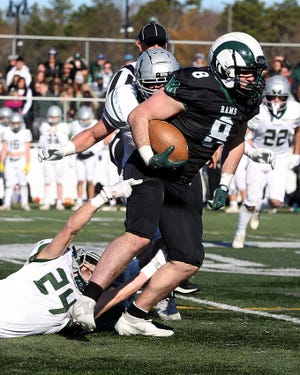 Marshfield's Jack Marini looks to escape the tackle during third quarter action of their game against Duxbury on Thanksgiving Day at Marshfield High School on Thursday, Nov.  24, 2022. 