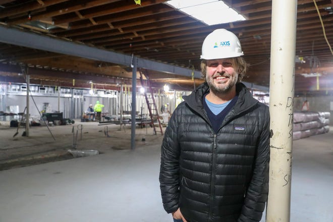 Rob Littleton, co-owner of Littleton's Market, stands in the store at 2140 Tremont Center as construction continues. Littleton hopes to open the outdoor pavilion in the spring and the full store in the summer.