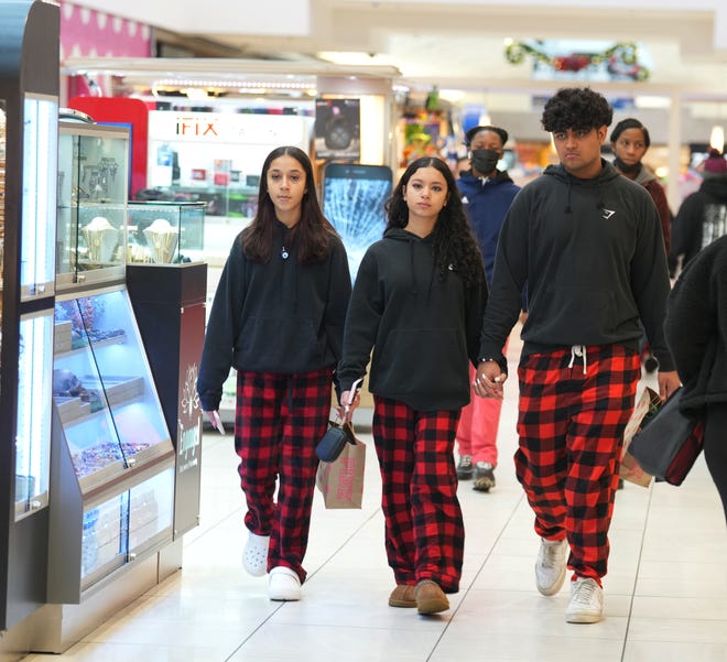 Janice Levaro, Olivia Alvarez and Karan Popoi, all of Mount Olive, browse for gifts during Black Friday at Willowbrook Mall in Wayne, New Jersey on November 25, 2022.