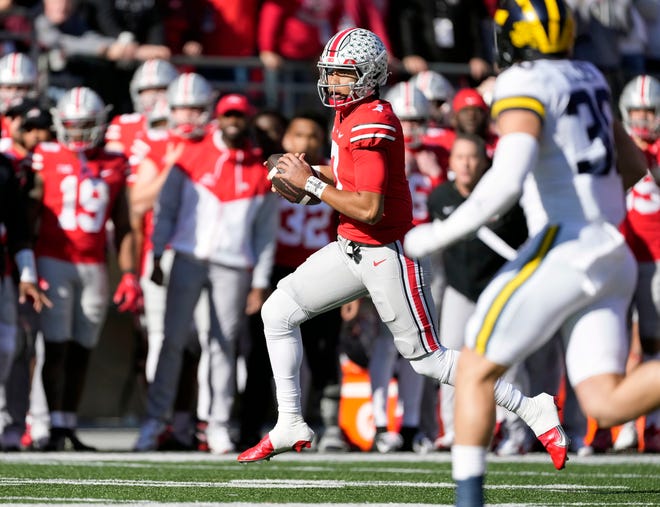 Nov 26, 2022; Columbus, OH, USA; Ohio State Buckeyes quarterback C.J. Stroud (7) runs the ball against Michigan Wolverines in the first quarter of their game at Ohio Stadium. 
