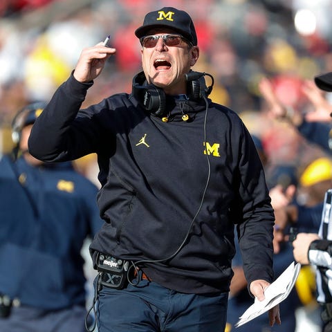 Michigan coach Jim Harbaugh watches a play against