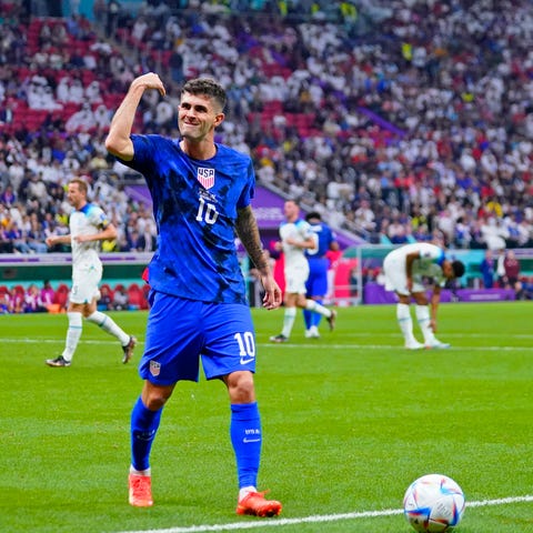 USMNT forward Christian Pulisic gestures toward fa