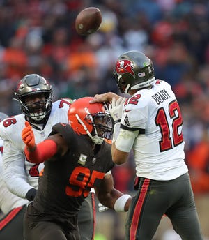 Browns defensive end Myles Garrett deflects Buccaneers quarterback Tom Brady's pass in overtime, Sunday, Nov. 27, 2022, in Cleveland.