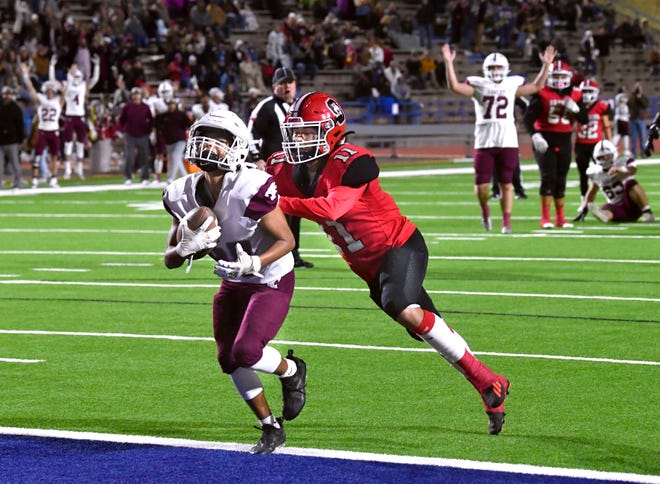 Hawley freshman Drew Siller is pushed into the end zone by Sonora defensive back Hunter O'Banon, scoring a touchdown during Saturday's Class 2A Div. I semifinal game against Sonora in San Angelo.