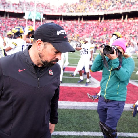 Ohio State coach Ryan Day walks away after the pos