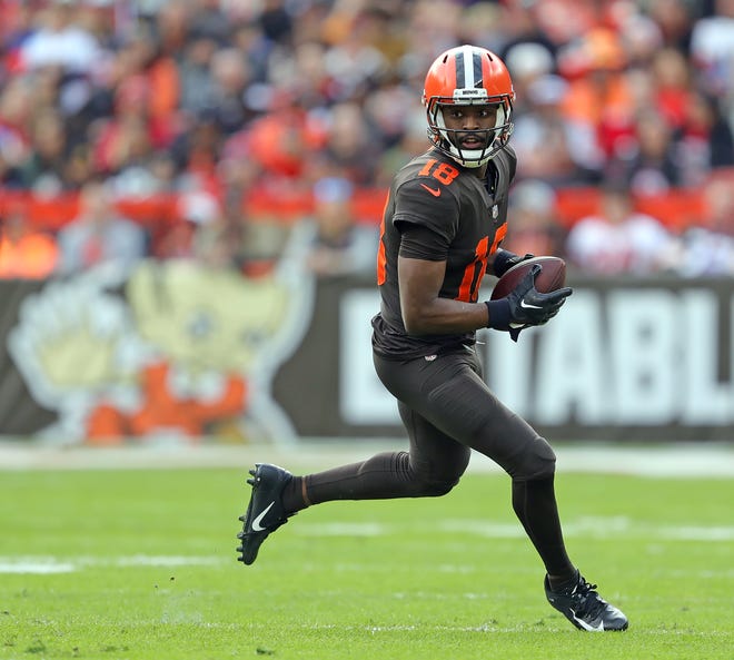 Cleveland Browns wide receiver David Bell (18) runs for yards after a catch during the first half of an game against the Tampa Bay Buccaneers at FirstEnergy Stadium on Nov. 27 in Cleveland.