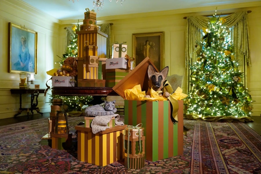 Depictions of Willow, bottom left, and Commander, the Biden family's cat and dog, are part of decorations in the Vermeil Room of the White House during a press preview of holiday decorations at the White House, Monday, Nov. 28, 2022, in Washington.