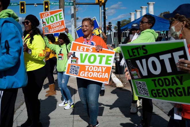 People gather during a voting rally on Sunday, Nov. 11.  Atlanta, 27, 2022, during early voting for the Senate runoff election.